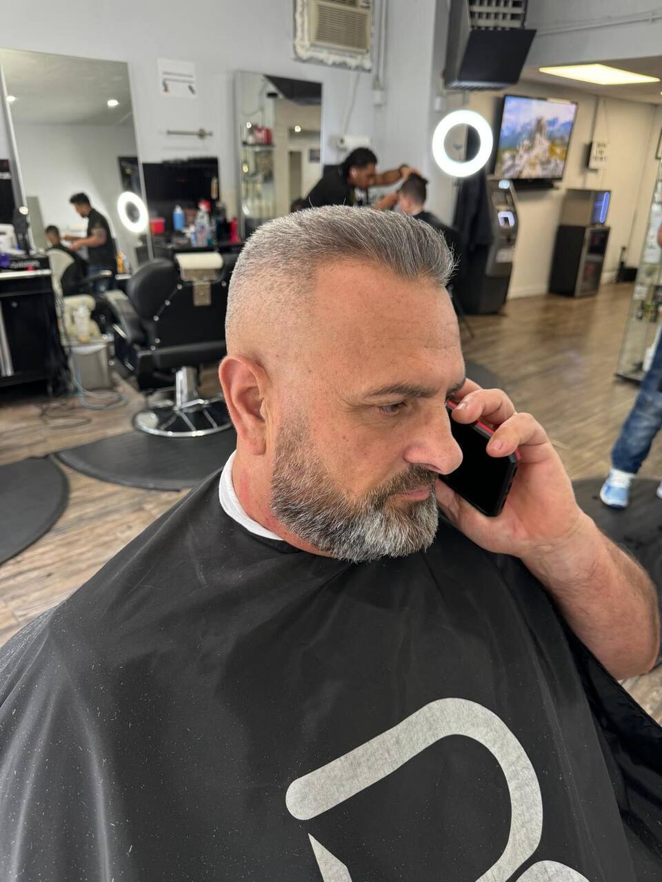 Salt-and-pepper crew cut with beard